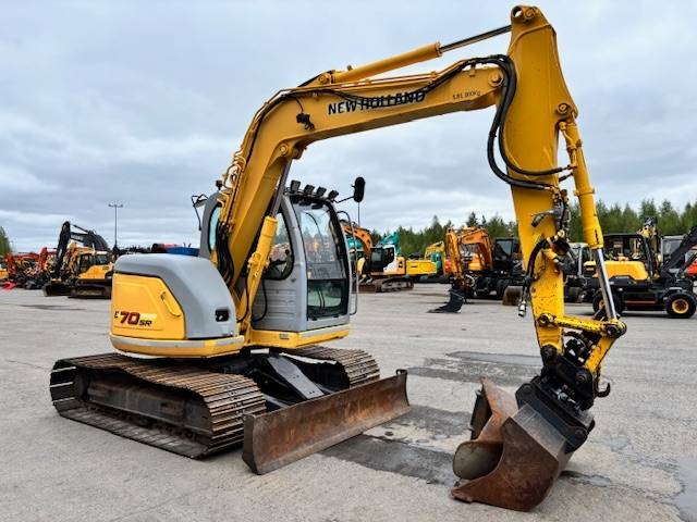 new-holland-e-70-myyty-sold,24f7bb42