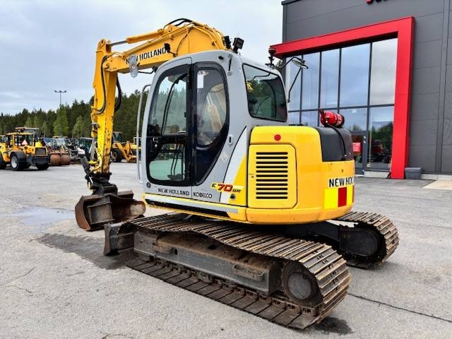 new-holland-e-70-myyty-sold,41e2207b