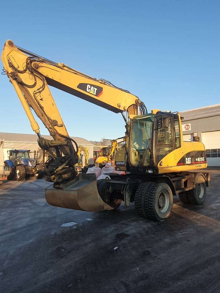Caterpillar M 315 C, Pelle sur pneus, Travaux Publics