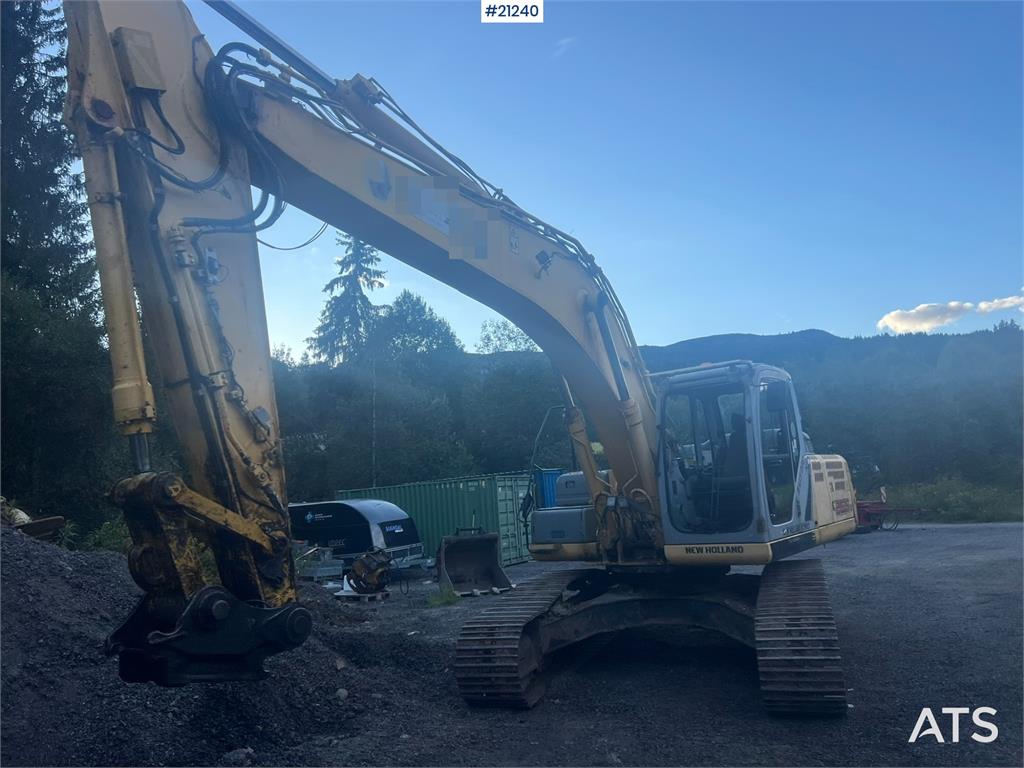 New Holland E265B Excavator w/ digging bucket and hydraulic sa