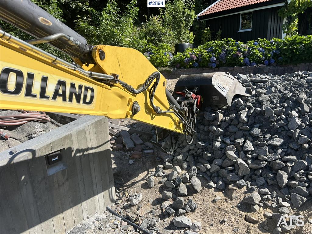 New Holland E55B excavator w/ digging bucket, sanding bucket,