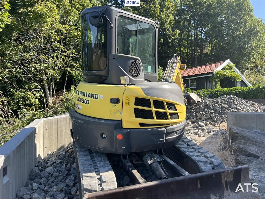 New Holland E55B excavator w/ digging bucket, sanding bucket,