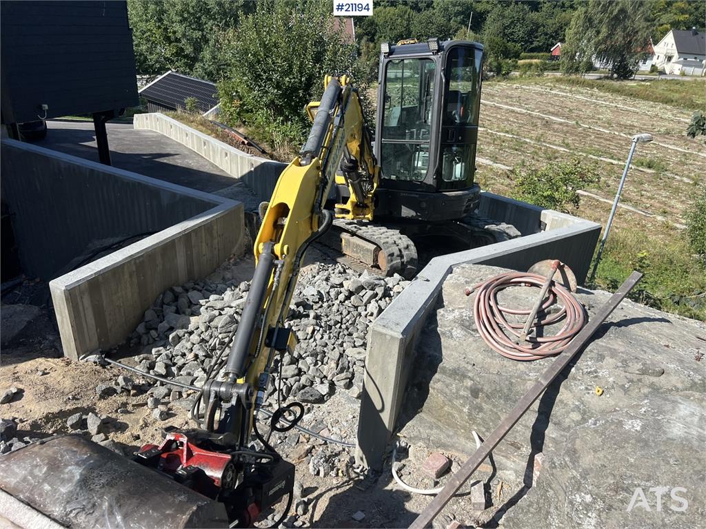 New Holland E55B excavator w/ digging bucket, sanding bucket,