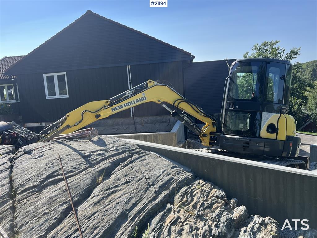 New Holland E55B excavator w/ digging bucket, sanding bucket,