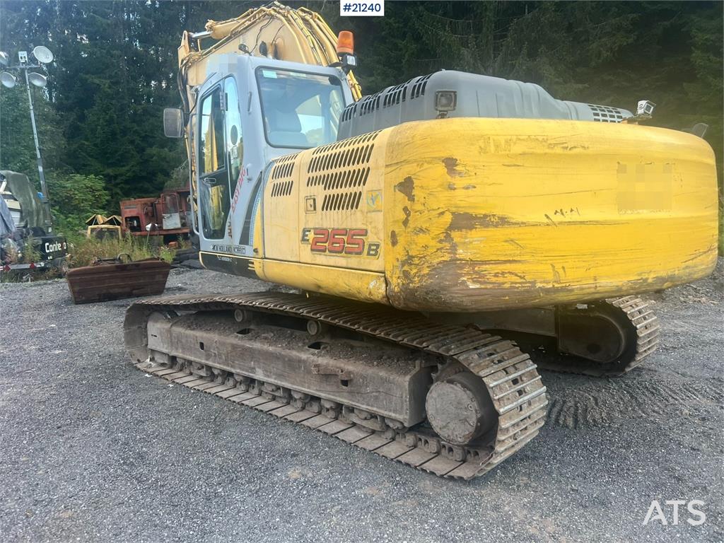 New Holland E265B Excavator w/ digging bucket and hydraulic sa