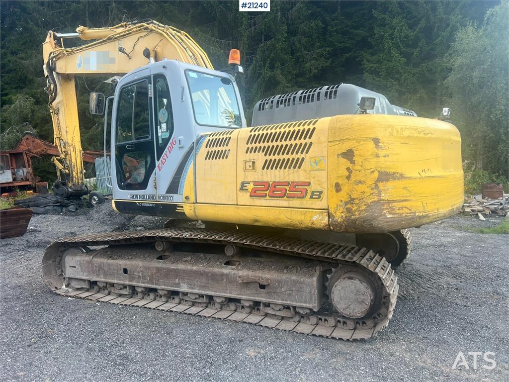 New Holland E265B Excavator w/ digging bucket and hydraulic sa