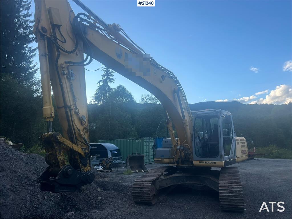 New Holland E265B Excavator w/ digging bucket and hydraulic sa
