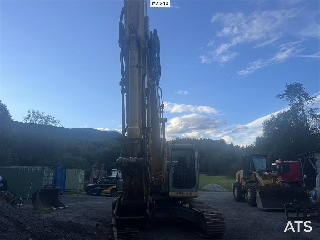 New Holland E265B Excavator w/ digging bucket and hydraulic sa