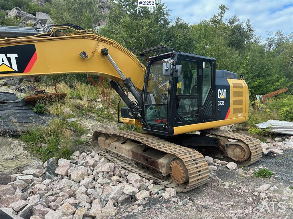 CAT 323E excavator w/ 3 buckets.