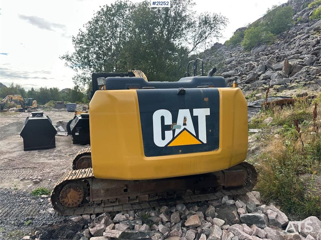 CAT 323E excavator w/ 3 buckets.