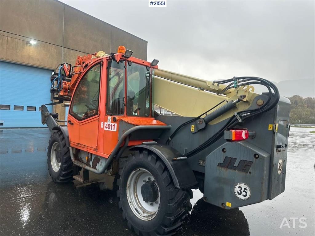 JLG 4017 telehandler w/ two pallet forks and bucket. C