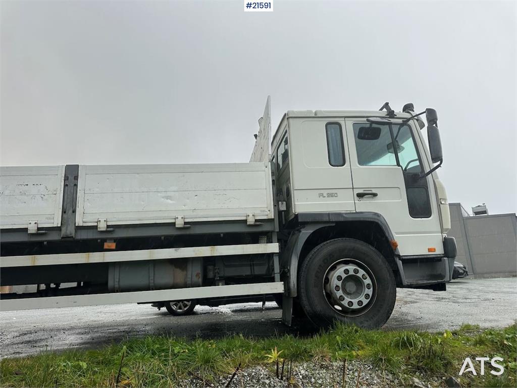 Volvo FL 6 flatbed truck w/ rear mounted crane. WATCH VI