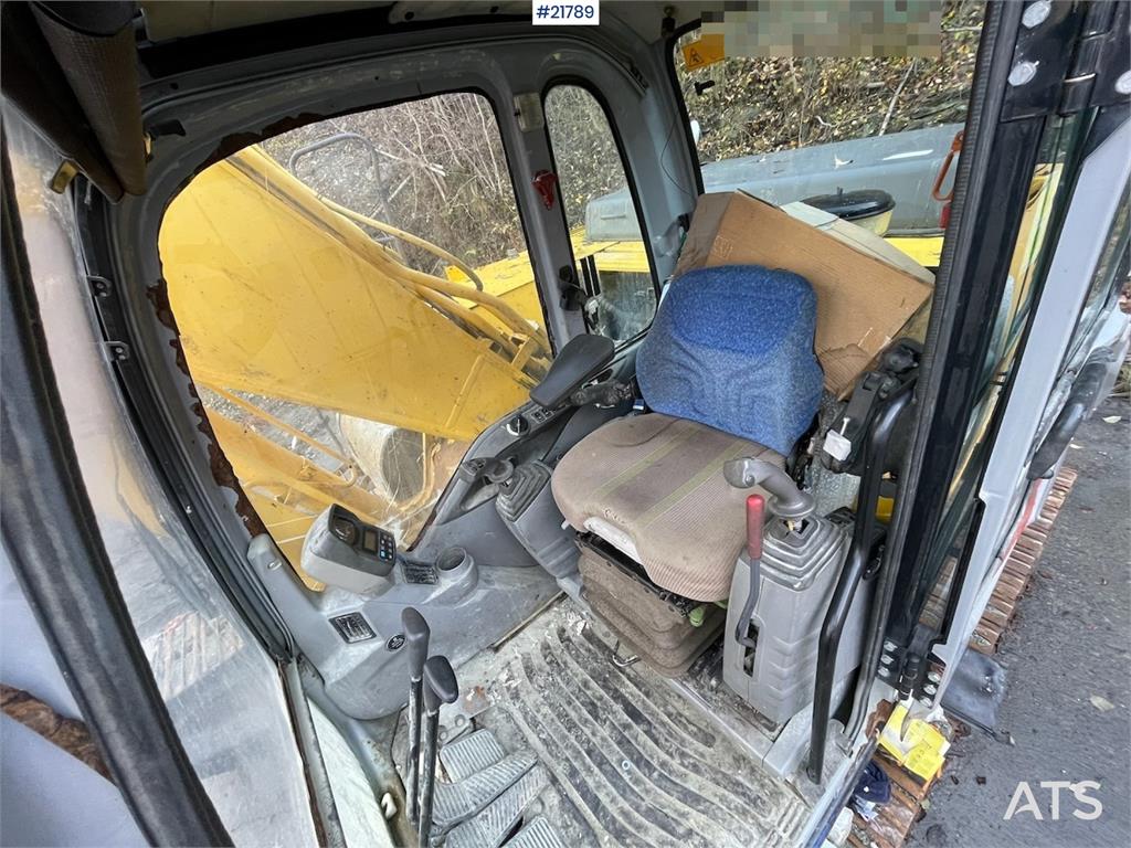 New Holland Kobelco E 265 with flap excavator bucket